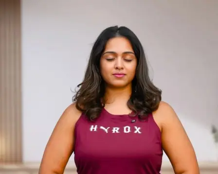 Sahithi meditating in a yoga pose
